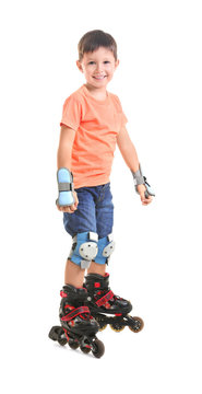 Boy on roller skates against white background