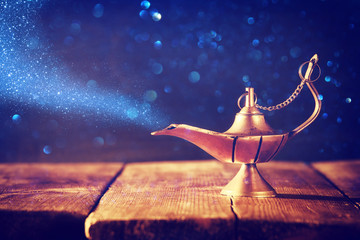 Image of magical aladdin lamp with glitter smoke. Lamp of wishes.