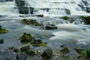 River flowing over boulders.