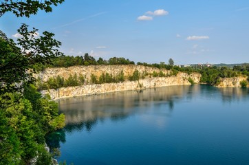 Fototapeta na wymiar Beautiful quarry with blue water. Water reservoir Zakrzowek in Krakow, Poland.