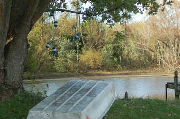 Fototapeta premium Rowboat beside a rural pond