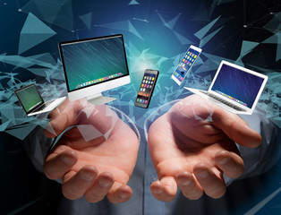 Computer and devices displayed on a futuristic interface - Multimedia and technology concept