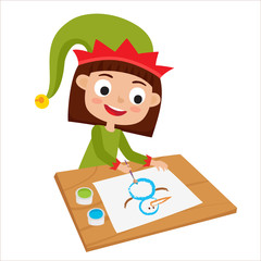 Little elf girl artist sitting at table and painting snowman.