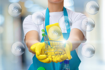 Worker shows a basket with a washcloth against the background of bubbles with interest.