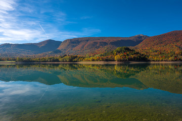 The autumn with foliage in the National Park of Abruzzo, Lazio and Molise (Italy) - An italian mountain natural reserve, with little old towns, the Barrea Lake, Camosciara, Forca d'Acero, Val Fondillo