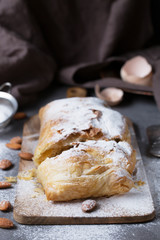 Apple strudel with almonds, vertical, selective focus