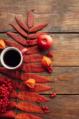 Hot beverage to keep warm in autumn. Black coffee or tea concept. Fall leaves background