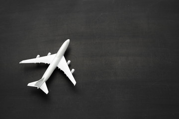 Miniature airplane on black background