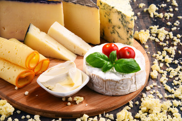 Different sorts of cheese on kitchen table