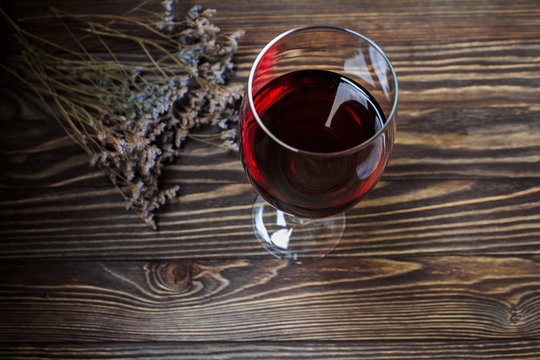  Glass Of Red Wine On Wooden Bacground