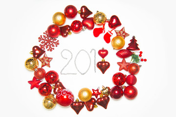 Top view on frame made of christmas decoration with new year balls on isolated white background with inscription 2018