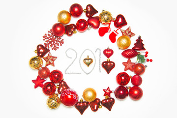 Top view on frame made of christmas decoration with new year balls on isolated white background with inscription 2018