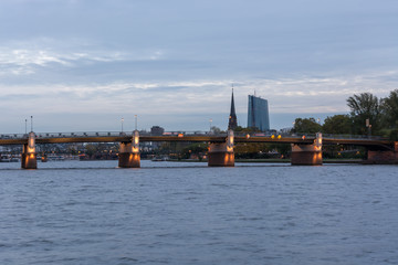 Naklejka premium The Untermain bridge over the river Main in Frankfurt with the EZB bulding