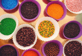 colored topping for confectioner, sprinkling of ice cream, many different colors and tastes