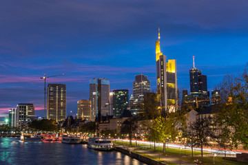 The skyline of Frankfurt with the river Main during blue hour close up