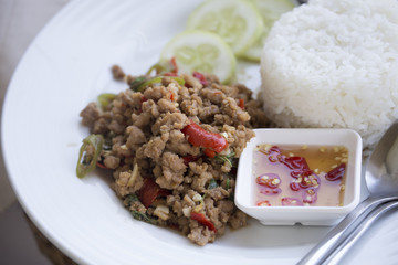Stir-fried minced pork with holy basil and steamed rice (Thai food).
