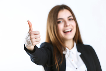 Beautiful caucasian brunette businesswoman wears black jacket show thumb up sign on white isolated background with copyspace
