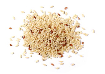 Integral, brown rice pile isolated on white background, top view