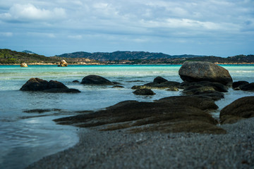Fototapeta na wymiar Stones and Beach Lu impostu, San Teodoro, Sardinia, Italy