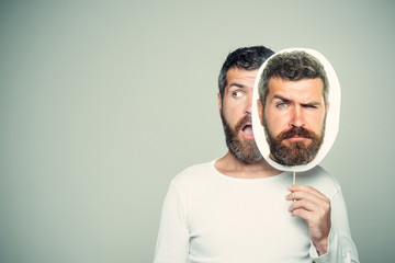 Guy or bearded man on grey background.