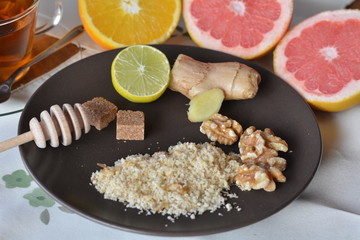 Breakfast table arrangement with grapefruit,orange, lemon and ground walnut.
