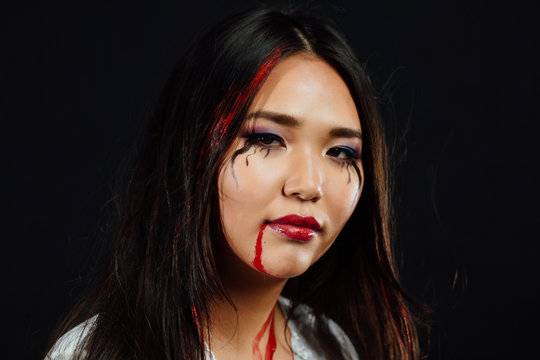 close-up portrait of a young, beautiful Asian girl on Halloween make-up. Close-up.