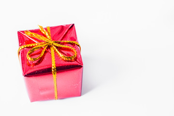 Close up of red xmas gift. Christmas and New Year concept with copy space. Christmas greeting card.