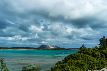 Tavolara with shadow Beach Lu impostu, San Teodoro, Sardinia, Italy
