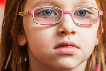 Closeup of young toddler girl in eyeglasses