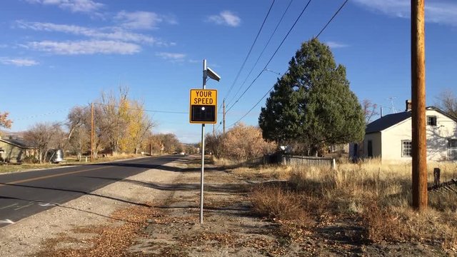Speed limit sign flashing warning, speeding