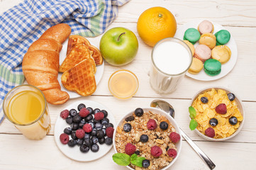 Breakfast served with orange juice, croissants, cereals and fruits. Balanced diet.