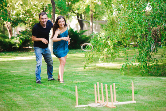 Friends Plaing Outdoor Games - Ring Toss.