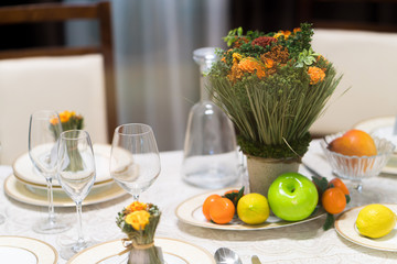 Beautiful table set with flowers for a festive event, party or wedding reception