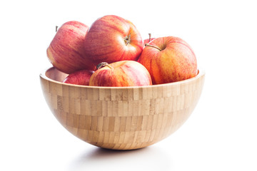 Fresh apples in wooden bowl.