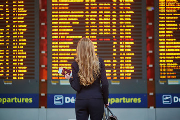 Young elegant business woman in international airport