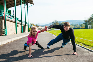 Man and woman doing push-up