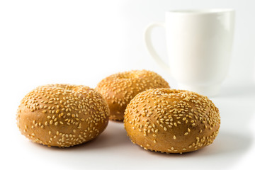 Three sandwich bun with sesame seeds isolated on white