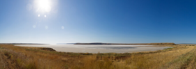 The dried salty lake. The water in the lake is pink. Panorama