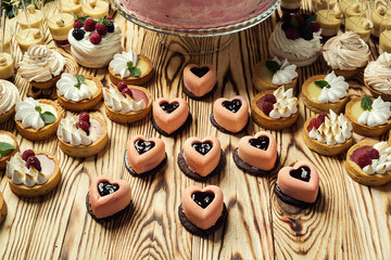 Candy Bar. Delicious sweet buffet with cupcakes. Sweet holiday buffet with cupcakes and other desserts.Table with sweets, candies, dessert,happy birthday concept