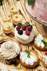 Candy Bar. Delicious sweet buffet with cupcakes. Sweet holiday buffet with cupcakes and other desserts.Table with sweets, candies, dessert,happy birthday concept
