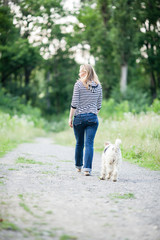 Woman walking with a pet  