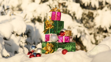 Christmas gifts in the snow-covered forest. New Year theme.