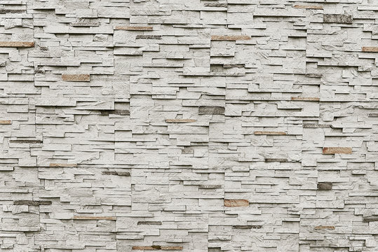 Old grey granite stone wall background texture
