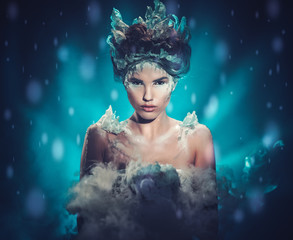 Fototapeta premium Beautiful ice queen in a falling snow