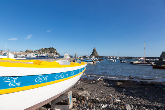 ITALY, ACITREZZA - October 07, 2017: Acitrezza and its little fishing port on cyclops riviera in Sicily, Catania.