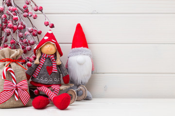 Obraz premium Christmas decor on the wooden white background.