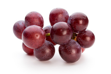 Ripe red grape isolated on white.