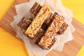 Healthy cereal bars on wooden table