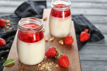 Delicious dessert with fresh strawberry on table