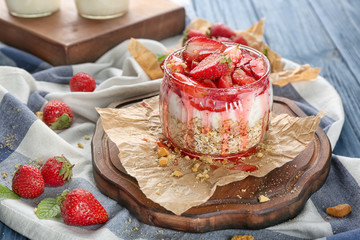 Delicious dessert with fresh strawberry on table